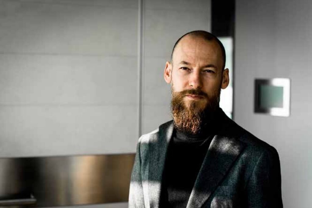 Portrait of a bearded man in a dark jacket
