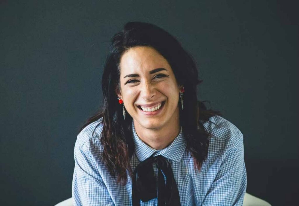 A laughing woman with dark hair